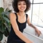 beautiful-woman-with-curly-hair-posing-confident-way